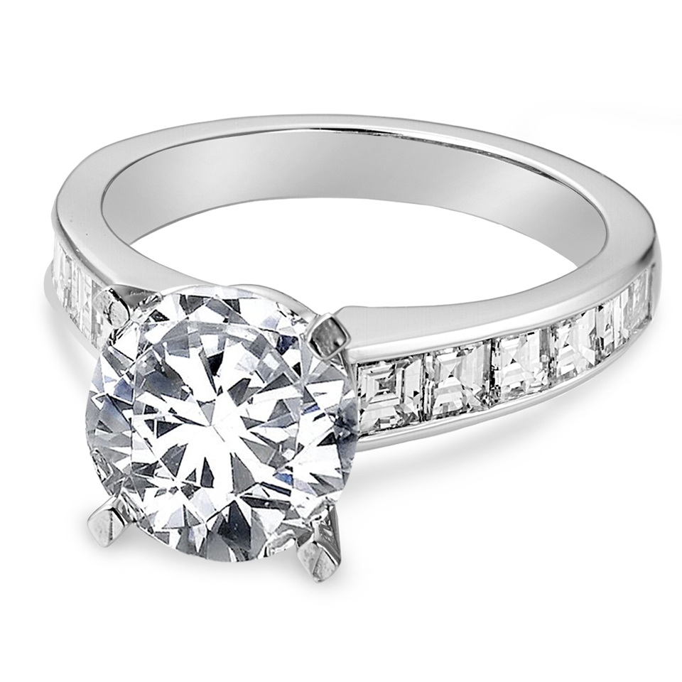 Platinum and diamond engagement ring with channel set side stones.