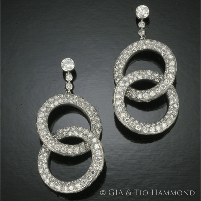 Cartier pavé round and channel set diamond earrings set in platinum. (c) GIA & Tino Hammid