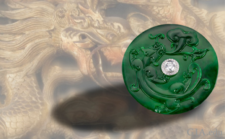 Jadeite jade carved dragon convertible brooch-pendant with a colorless diamond at the center.