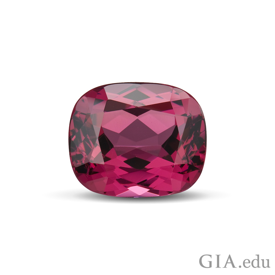 A 12.27 ct cushion cut rhodolite garnet from Tanzania.