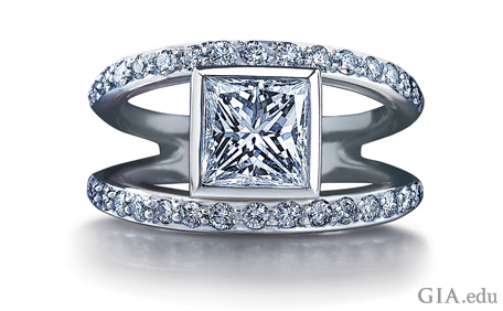 Split shank ring set with square-shaped center diamond and smaller diamonds along the shank.