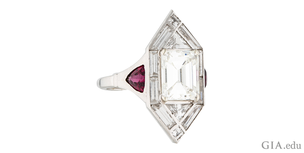 A 2.40 ct Art Deco engagement ring with 0.85 carats of baguettes, triangular diamonds and trilliant cut synthetic rubies