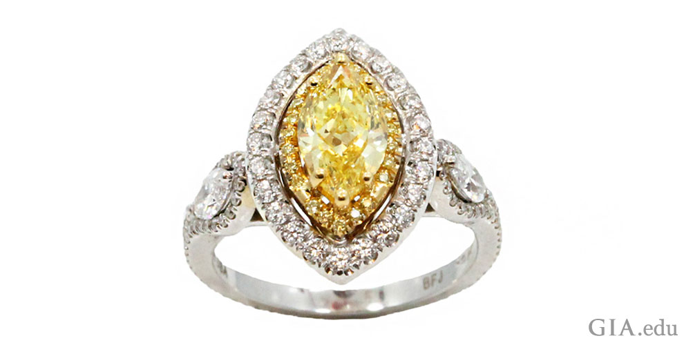 A 1.10 carat marquise yellow diamond engagement ring