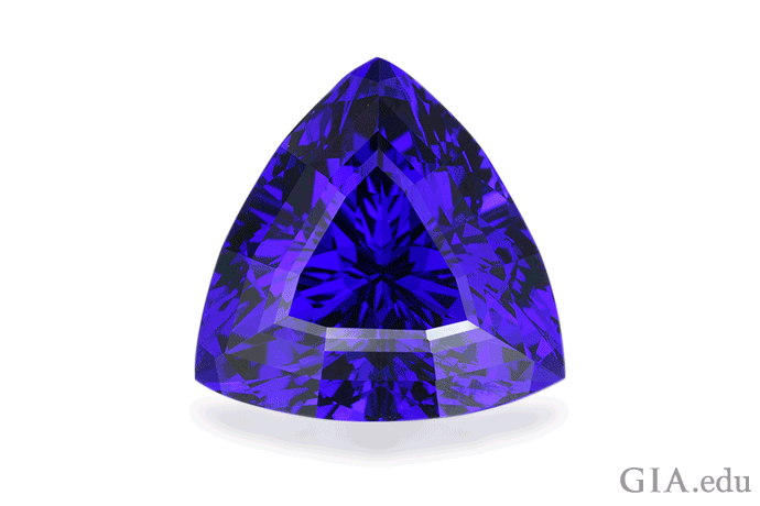 A trilliant shaped tanzanite with an exceptional violetish blue color captivates as the December birthstone. Photo: Robert Weldon/GIA