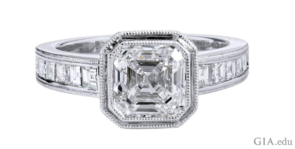 A 2.00 carat emerald cut diamond engagement ring framed by milgrain and another 0.75 carats of diamonds in the shank.