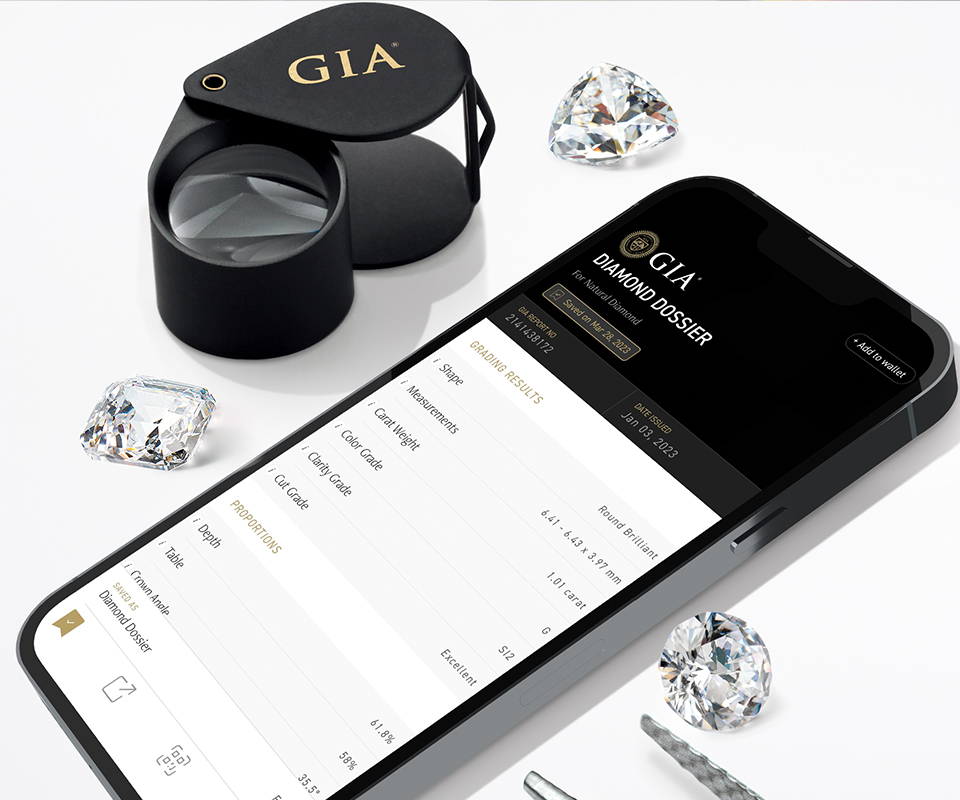 GIA Diamond Dossier on a smartphone with a loupe beside it