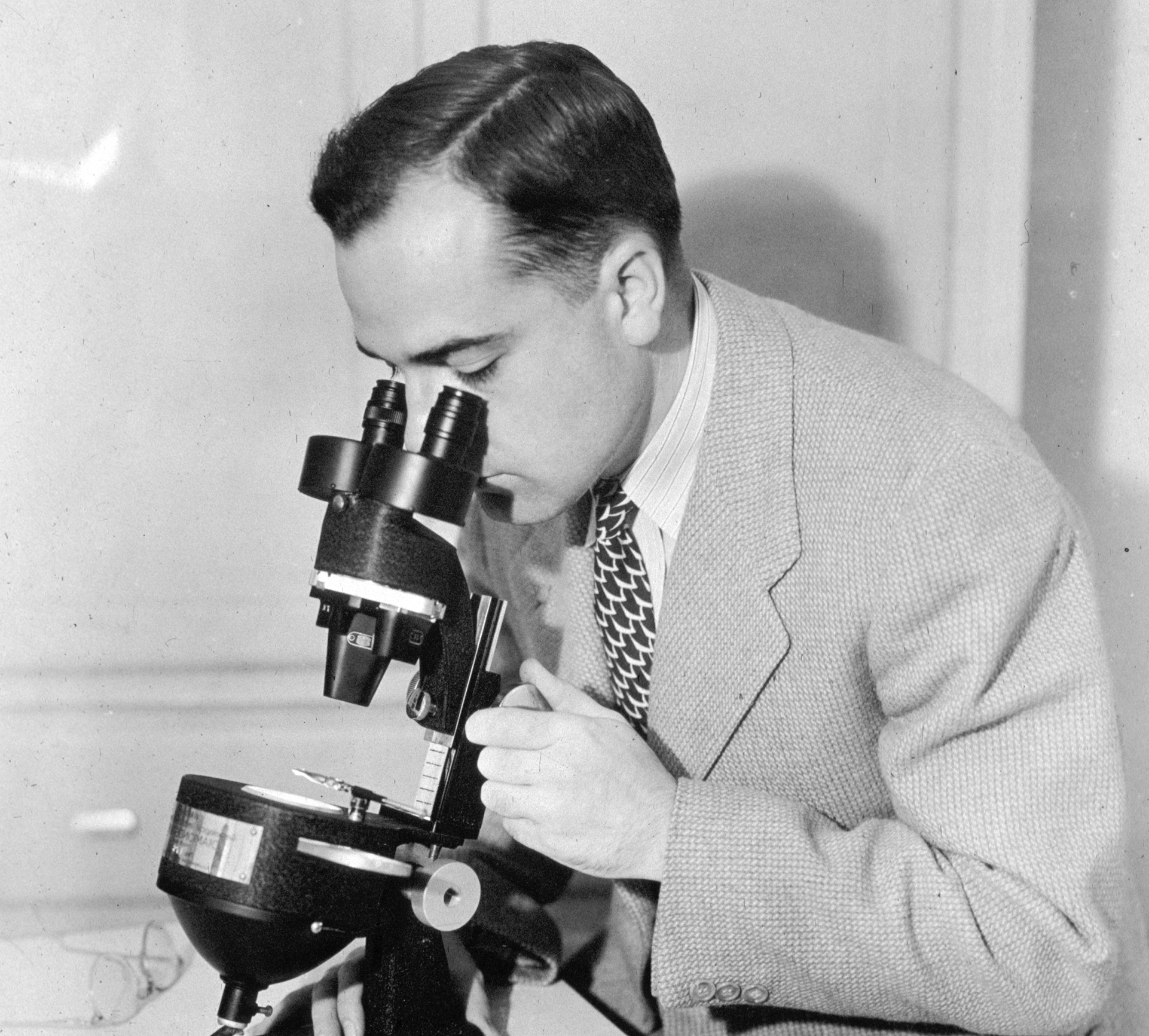 Robert Shipley looking into a microscope